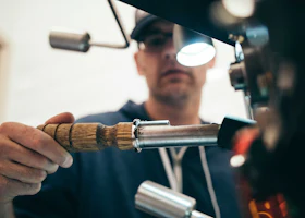 Audio Max: person holding recording equipment