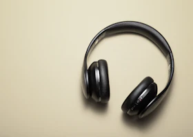 Stand Pro: black headphones, desaturated photo